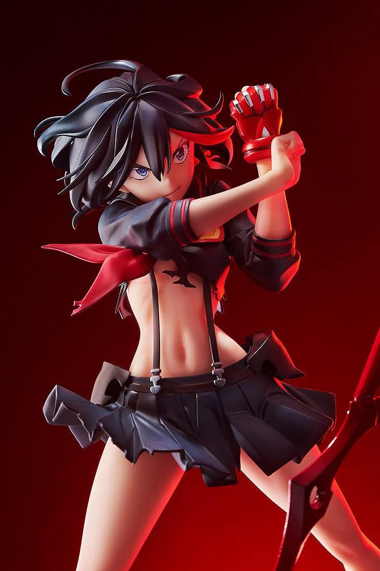 A close-up of the Ryuko Matoi figure's face and torso, highlighting her determined expression and the red Fighting Glove on her hand.