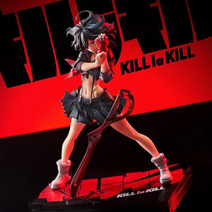 A low-angle shot of the Ryuko Matoi figure, emphasizing the intensity of her pose and the lighting against the red and black backdrop.