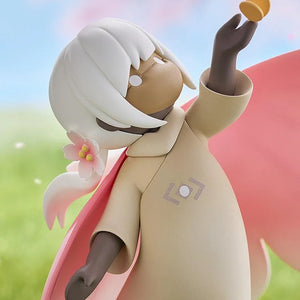 Close-up of the Child of the Light figure's face, looking up at the butterfly accessory with a soft, peaceful expression against a sky background.