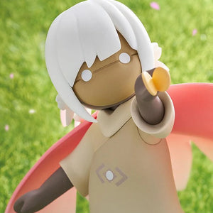 An extreme close-up of the figure's face and torso, highlighting the smooth sculpt and the butterfly accessory resting on its hand.