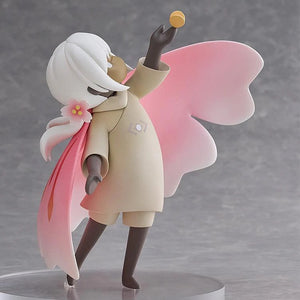 Side profile of the Child of the Light figure, showing the flow of the pink wing cape and the yellow light/butterfly accessory.