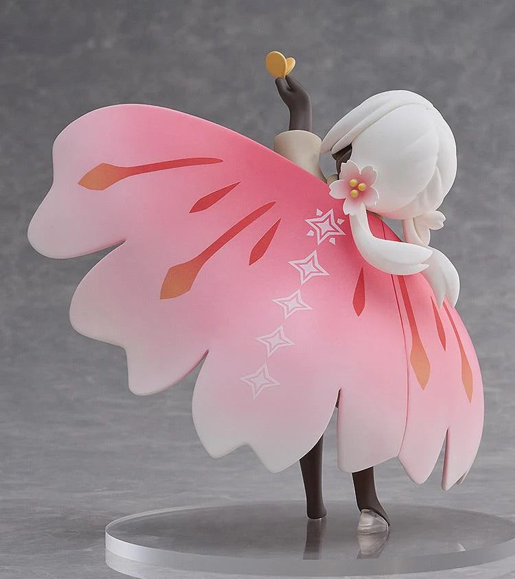 Rear view of the Child of the Light figure, focusing on the large, detailed pink wing cape with star patterns and the flower on its shoulder.