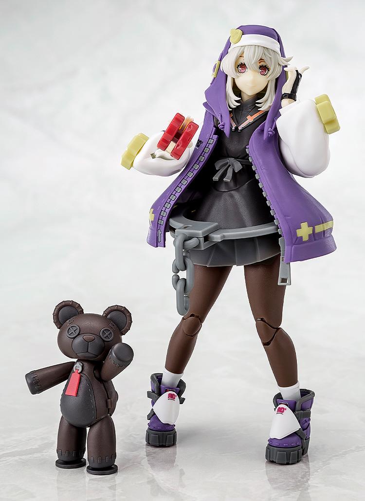 Full-body shot of Bridget in her purple hoodie standing next to a black Roger bear, showing the complete Guilty Gear -Strive- set.