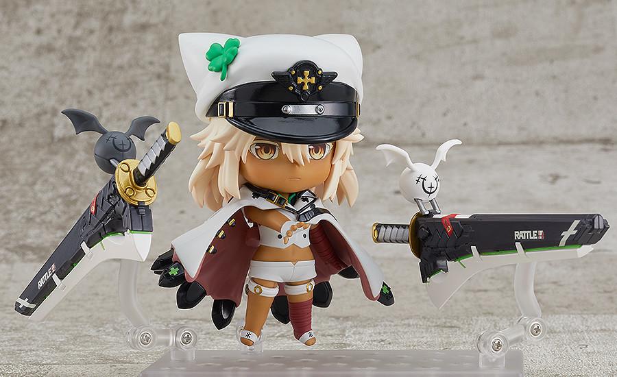 Ramlethal Valentine Nendoroid figure posing with clasped hands in front of her white cape and floating greatswords.