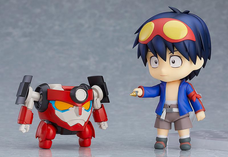 Separated Lagann form mecha standing next to Nendoroid Simon holding core drill