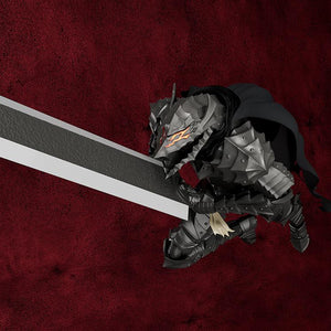 High-angle dynamic action pose of PLAMATEA Guts crouching low and preparing to strike with the massive Dragon Slayer greatsword.
