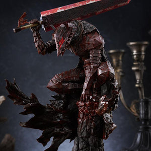 Medium close-up of Guts crouching atop rock pillar base with heavy blood splatter details on armor