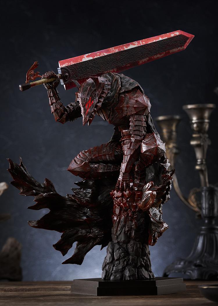 Medium close-up of Guts crouching atop rock pillar base with heavy blood splatter details on armor