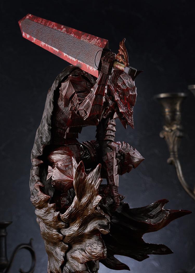 Close-up of Guts crouched in armor with blood painted plates and grip on Dragon Slayer sword hilt