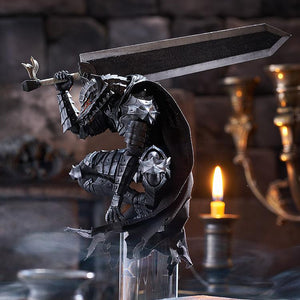 Wide atmospheric diorama photo of PLAMATEA Guts perched on a high stone pillar with the Dragon Slayer sword resting on his shoulder next to a lit candle.