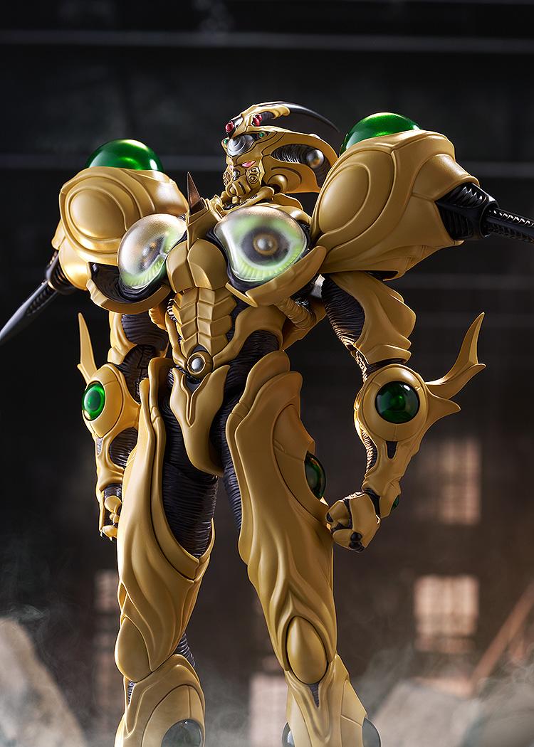 The Guyver Gigantic figma displaying the Giga-Smasher attack with its chest plates open, revealing glowing green orbs in a ruined city.