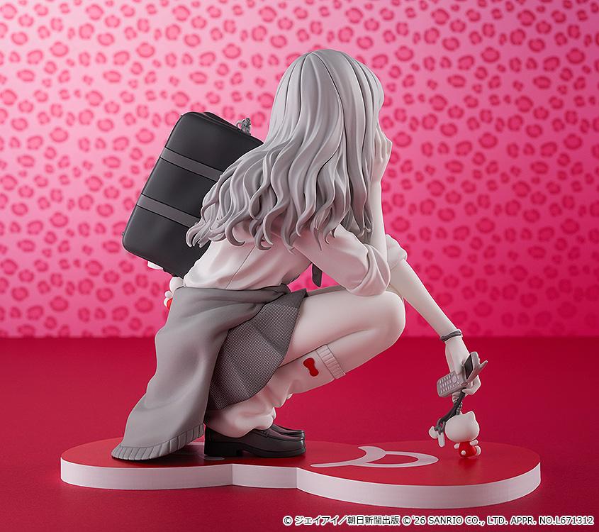 Rear three-quarter promotional angle of the Gyaru Tomie x Hello Kitty figure displaying her hair texture and accessories against a pink background.
