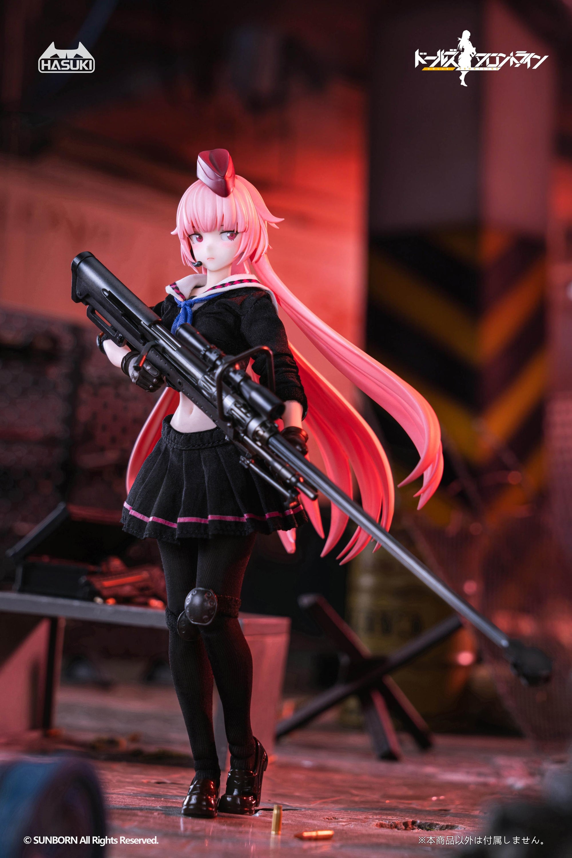 NTW-20 action figure holding her sniper rifle with a serious expression, posed in an industrial warehouse setting with bullet casings on the floor.