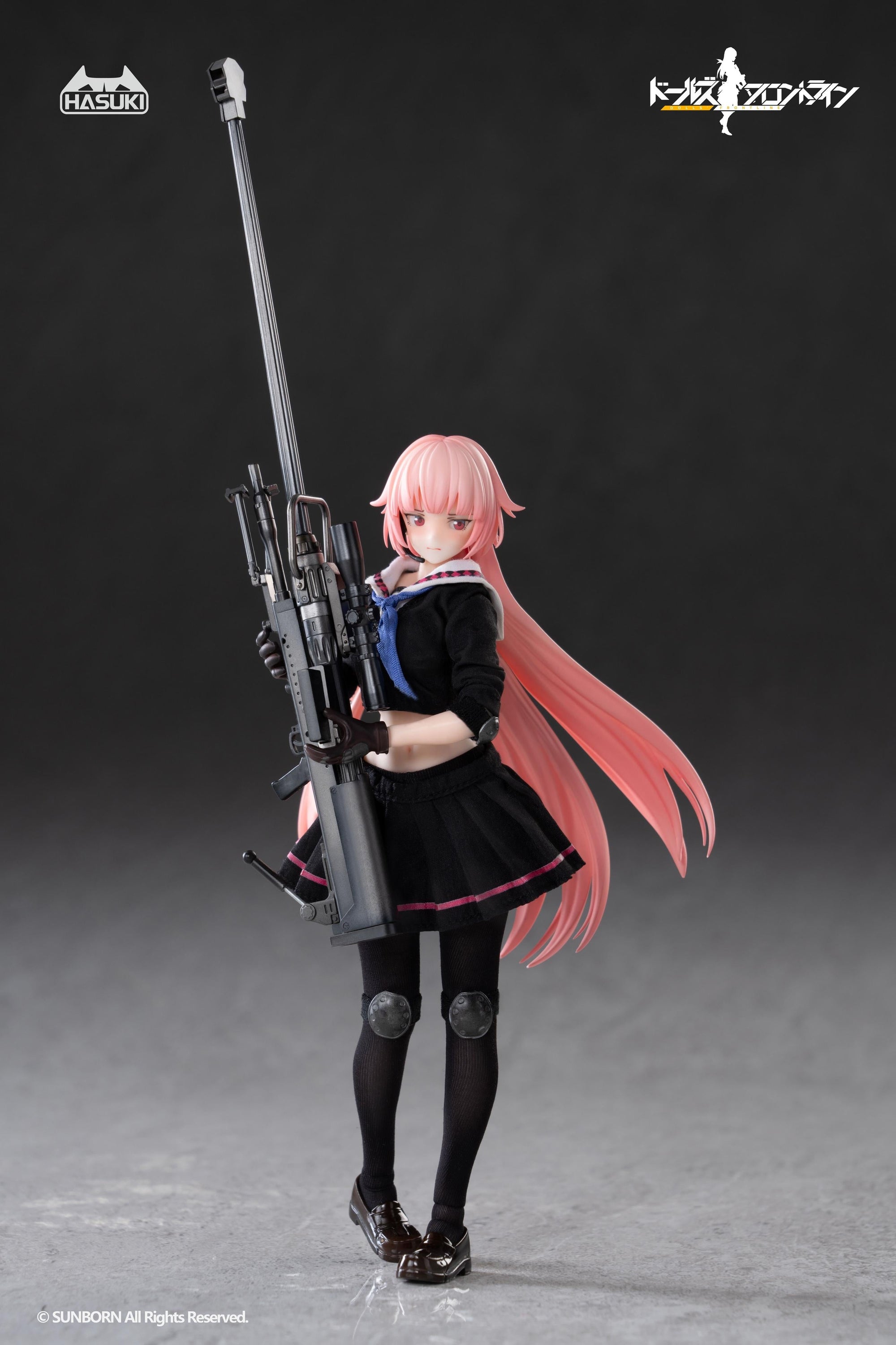The 1/12 scale NTW-20 action figure posed looking down thoughtfully while holding her rifle vertically.