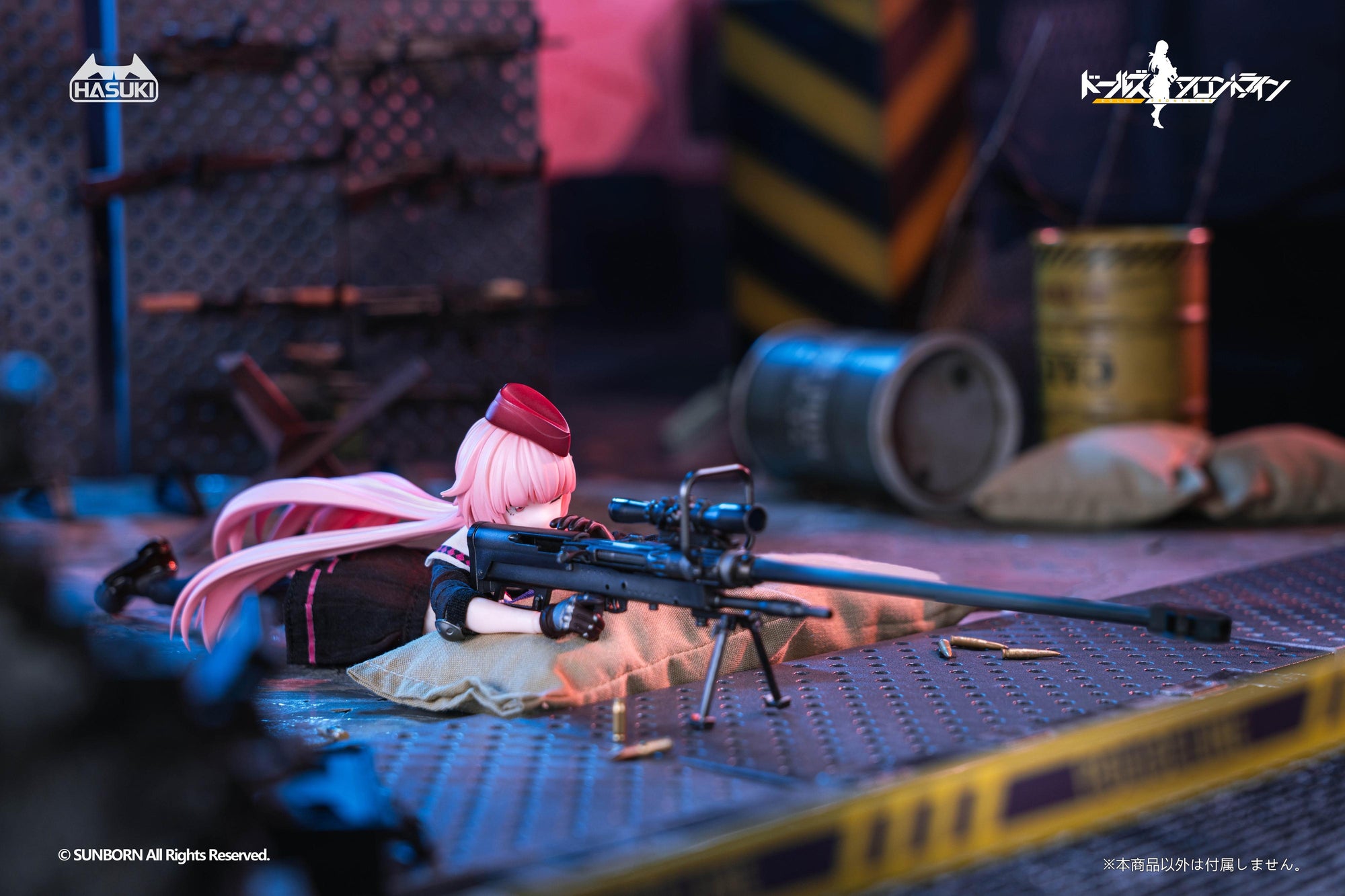 NTW-20 action figure in a prone sniper position, resting her rifle on a sandbag to take aim in an industrial scene.
