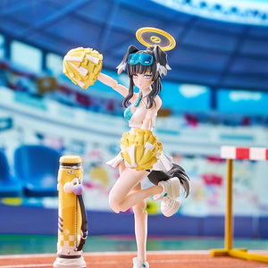 Scenario shot of Hibiki Cheer Squad posed on a realistic track and field stadium background with her mortar and pom-poms.