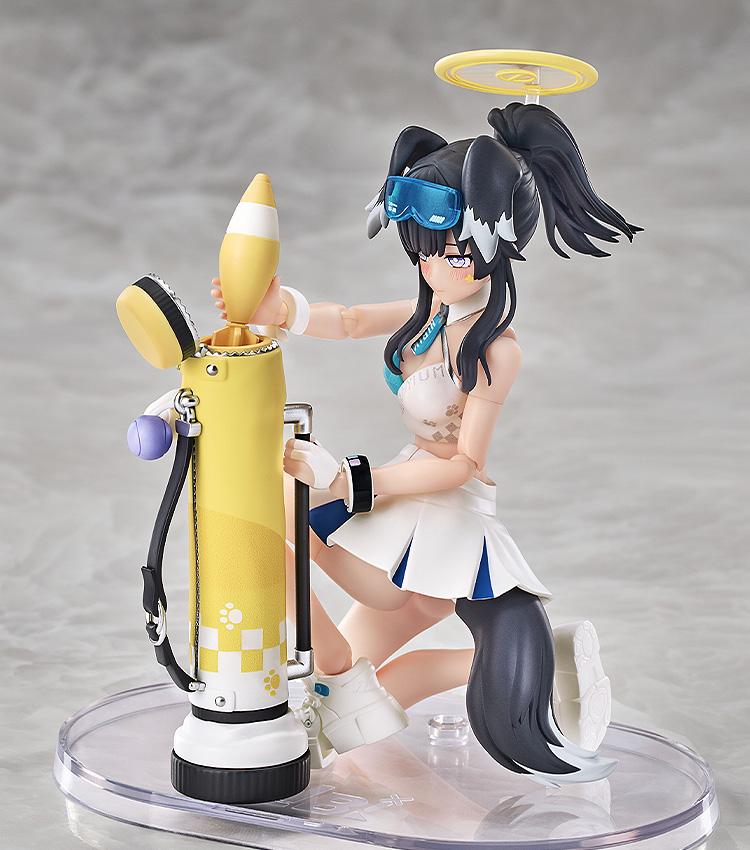 Hibiki kneeling to interact with a mortar shell accessory, highlighting the figure's impressive range of motion.