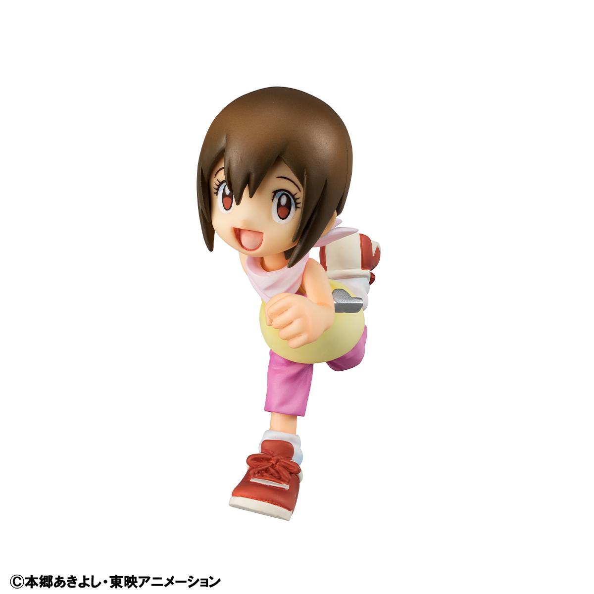Close-up detail of the Kari Kamiya (Hikari Yagami) figure in a joyful running pose with her signature pink shorts and yellow top.