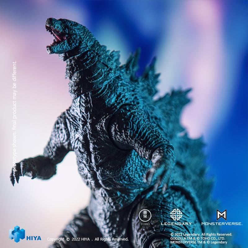 Low-angle shot of HIYA Exquisite Basic Godzilla vs. Kong action figure roaring upward under blue ambient lighting.