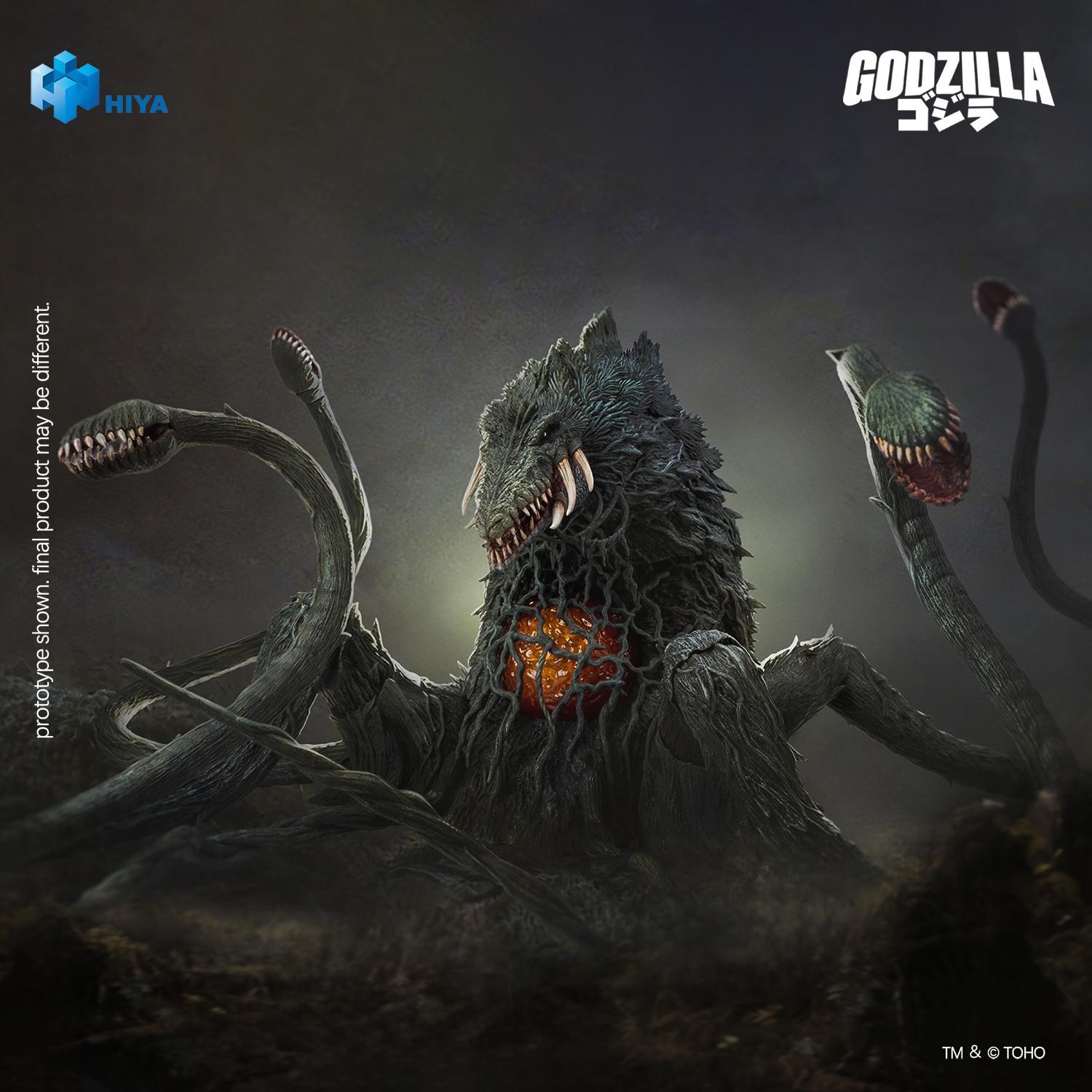 Dramatic front-angle promo shot of Biollante in dark atmospheric lighting highlighting the glowing core and surrounding fanged plant heads.