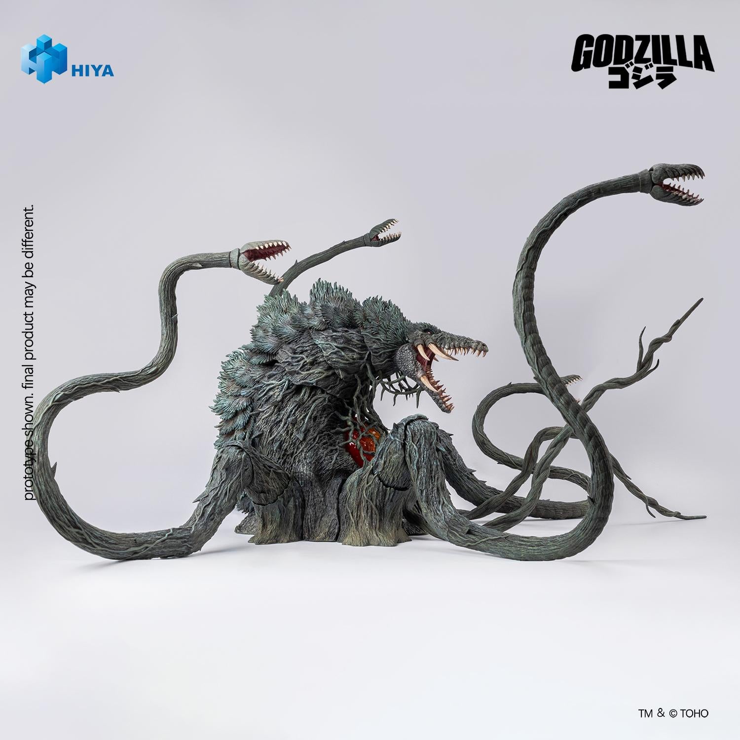 Right side profile of the Biollante figure displaying the crocodile-like head sculpt, spiny bark texture, and elevated tendril tentacles.