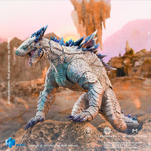 HIYA Toys Godzilla x Kong Shimo figure crouched on a rocky outcrop in a roaring quadruped stance