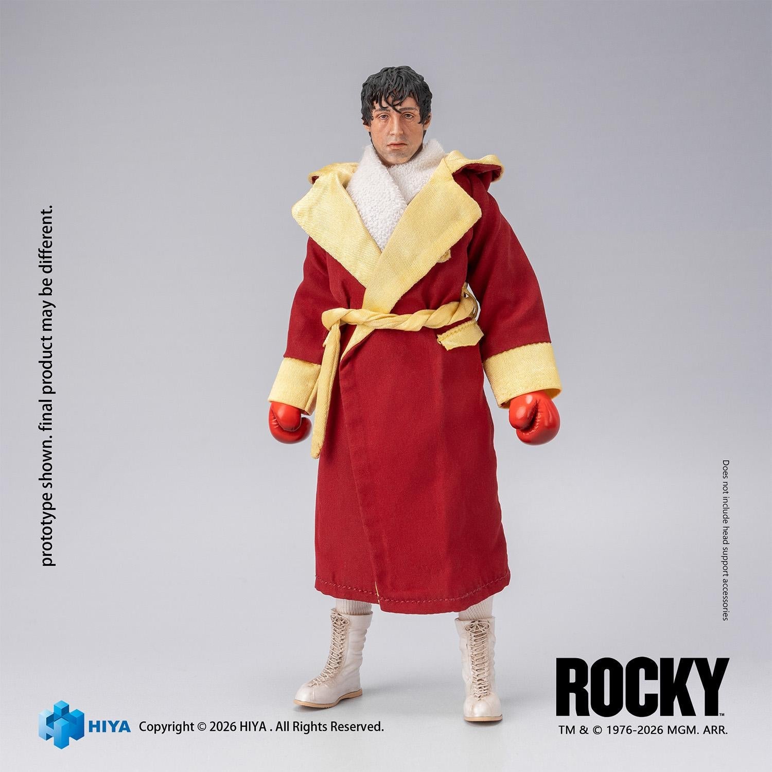 Full-body view of the 1/12 scale Rocky Balboa action figure wrapped in his iconic red entrance robe with yellow sash.