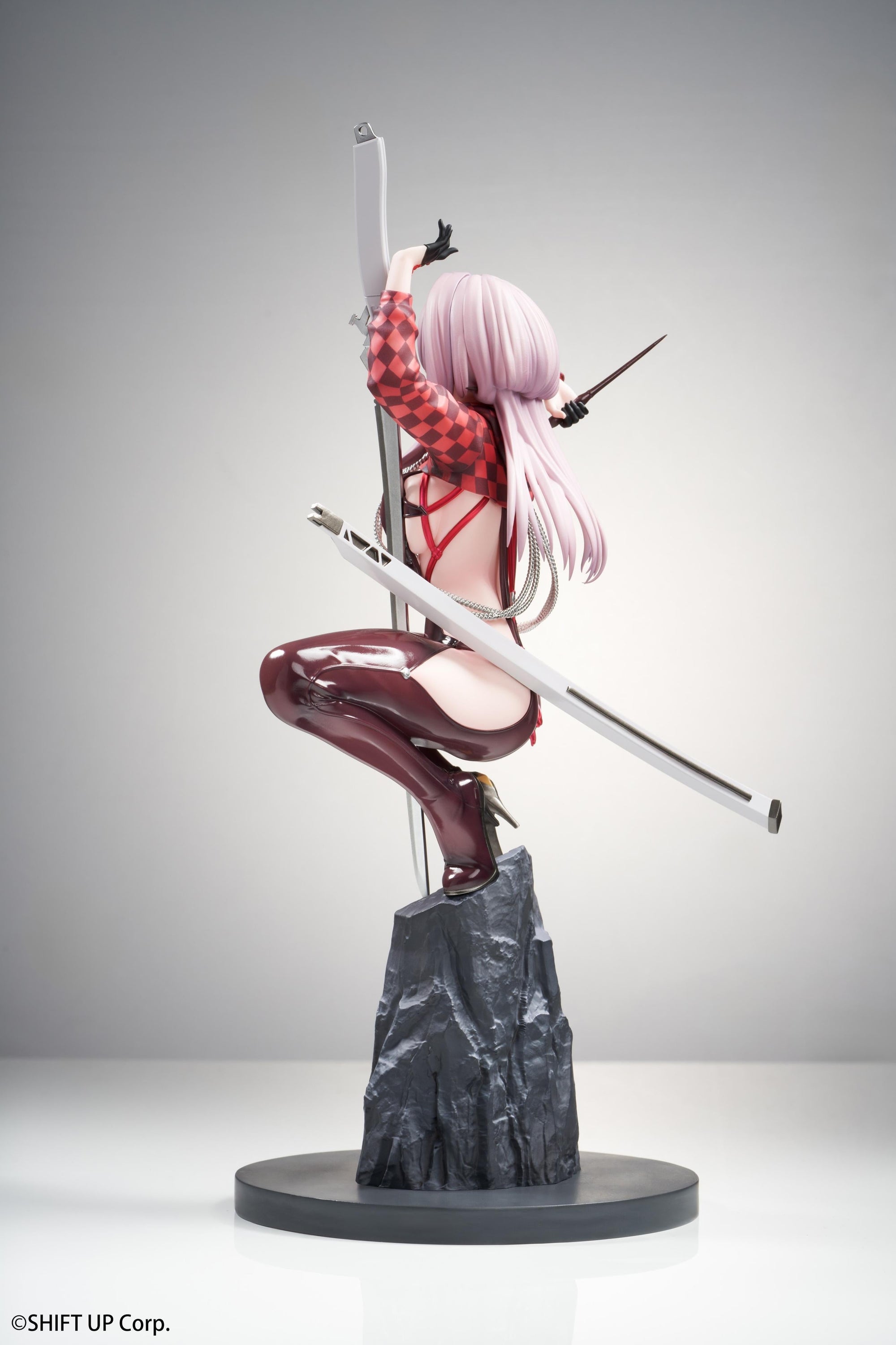 Left side profile of the Scarlet 1/10 scale figure showing her crouching posture and the length of her silver sword scabbard.