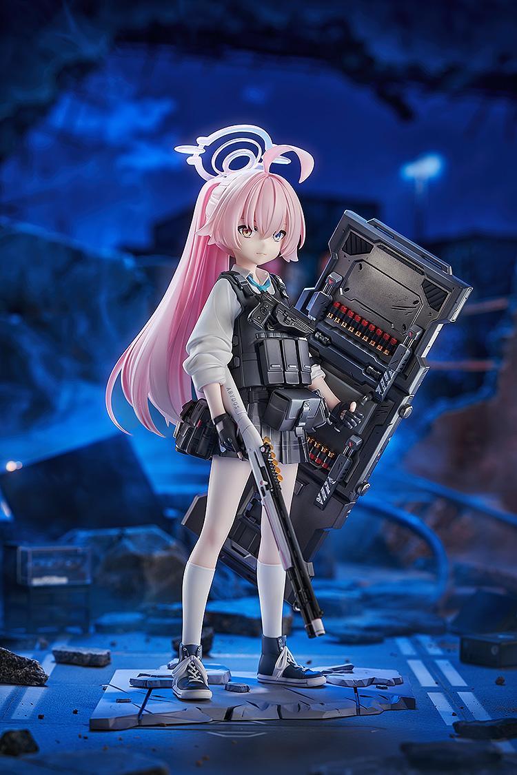 Blue Archive Hoshino Battle version figure standing on a cracked pavement base in a dark, atmospheric battlefield setting.