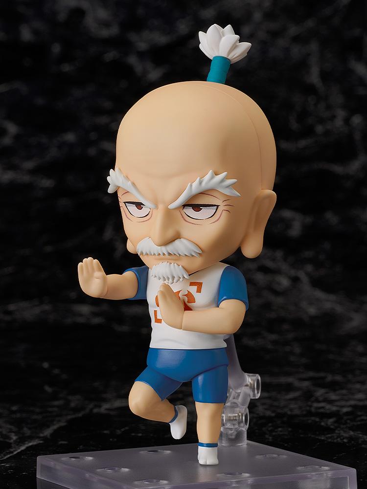The highly articulated Nendoroid Netero figure posed in a mid-air martial arts stance with one leg raised and an open palm strike.