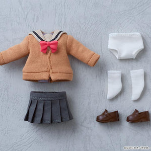 Flat lay view of the complete fabric box contents for the Ikuyo Kita Nendoroid Doll, showing the uniform top, pleated skirt, white underwear, white socks, and brown shoes.