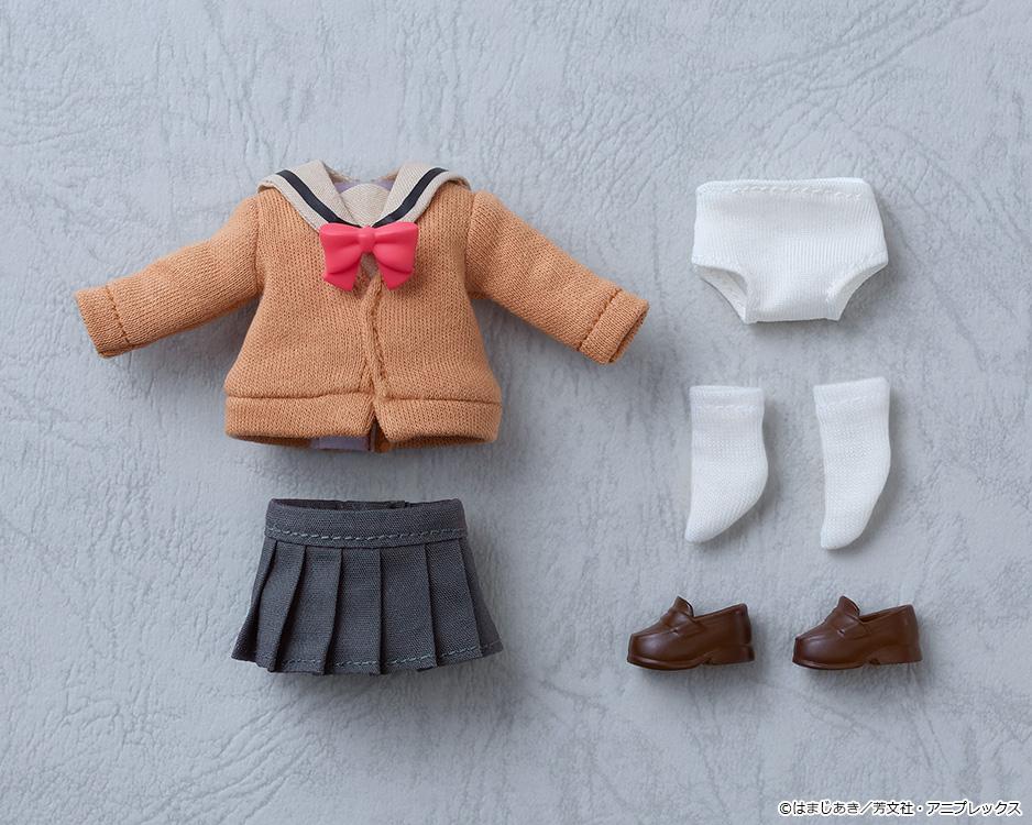 Flat lay view of the complete fabric box contents for the Ikuyo Kita Nendoroid Doll, showing the uniform top, pleated skirt, white underwear, white socks, and brown shoes.