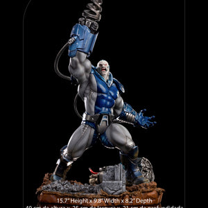 A product image of the Iron Studios Apocalypse X-Men 1/10 scale statue with overlaid text showing its dimensions as 15.7 inches tall and 7 lbs in weight.