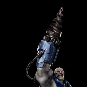 A close-up shot of the Apocalypse statue, focusing on his menacing face, blue and gray armor, and the large, detailed drill arm raised above his head.