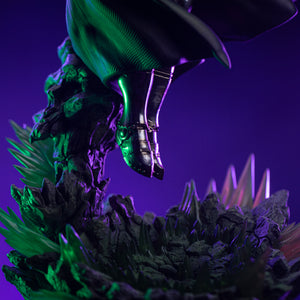 A low-angle close-up of Doctor Doom's armored boots hovering over the glowing green crystal and rock diorama base.