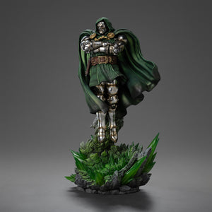 A front right view of the Doctor Doom statue, showing him floating with his cape billowing and a skull sculpted into the base behind him.