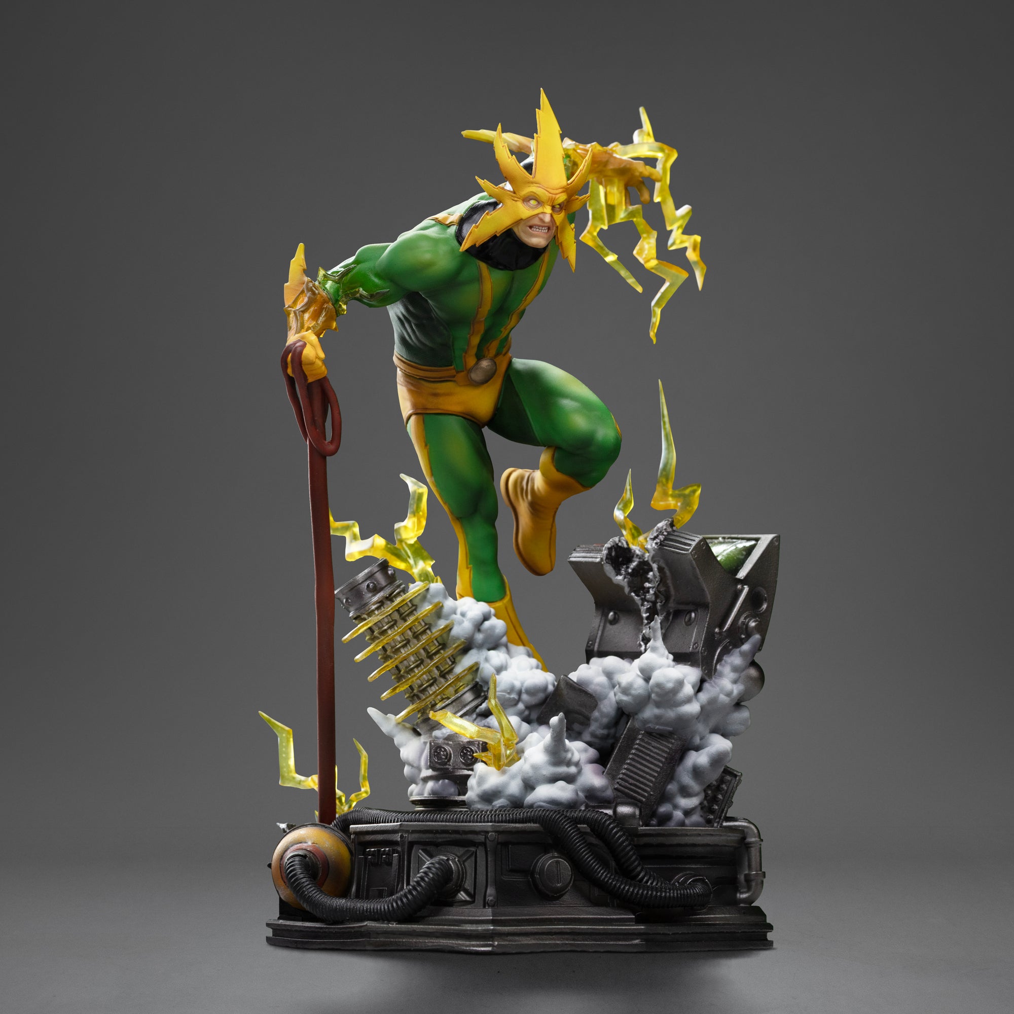 Frontal shot of the Electro statue, highlighting his classic green and yellow suit and his charged attack stance on the diorama base.