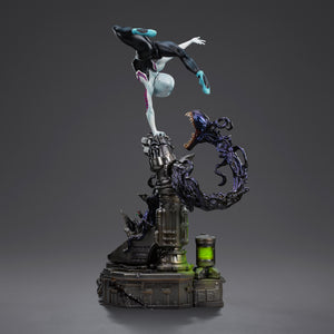 A back three-quarter view of the Ghost-Spider statue, highlighting the dynamic tension between the figure and the symbiotic tendril base.