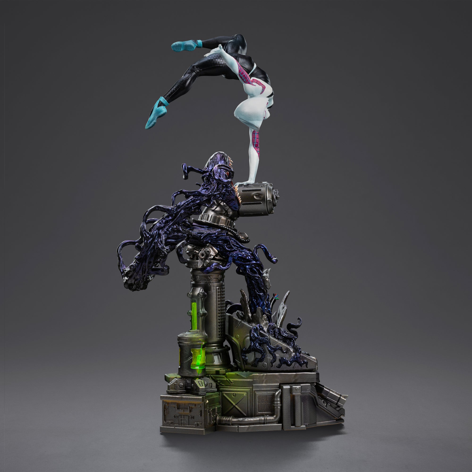 Rear view of the Ghost-Spider statue, showing her balanced on the industrial base while grappling with the black, venomized tendril.