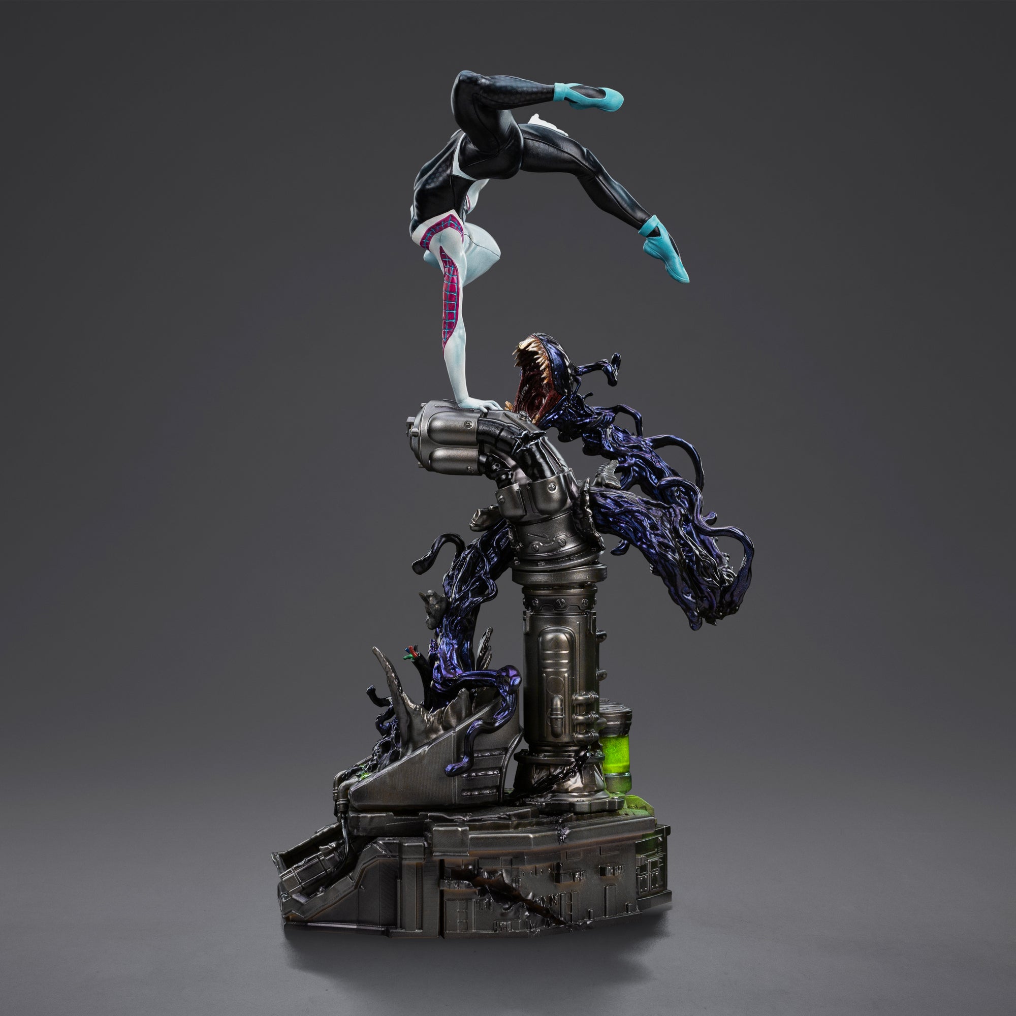 A side angle of the Ghost-Spider statue, emphasizing her acrobatic pose, black and white suit, and the monstrous black symbiote base element.