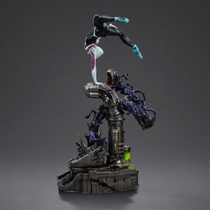 A side angle of the Ghost-Spider statue, emphasizing her acrobatic pose, black and white suit, and the monstrous black symbiote base element.