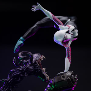 A close-up of Ghost-Spider's torso and mask, showing the intricate webbing pattern and the threatening symbiote tendril below.