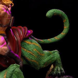 Close-up of the back of the Iron Studios Battle Cat statue, detailing his curled green and yellow tail and the back of his dark red saddle.
