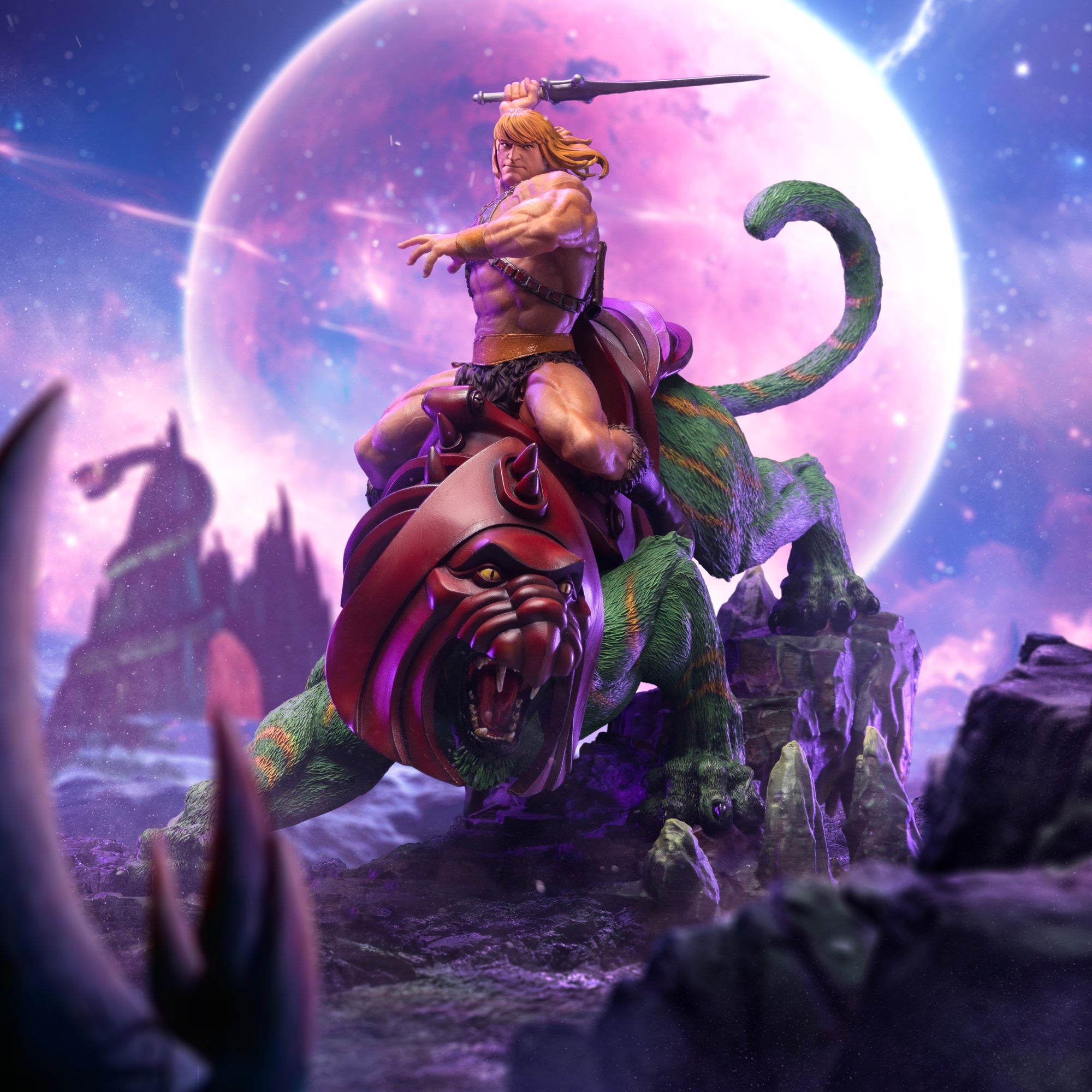 Masters of the Universe He-Man and Battle Cat deluxe statue showcased with a cinematic purple planet and starry space background.