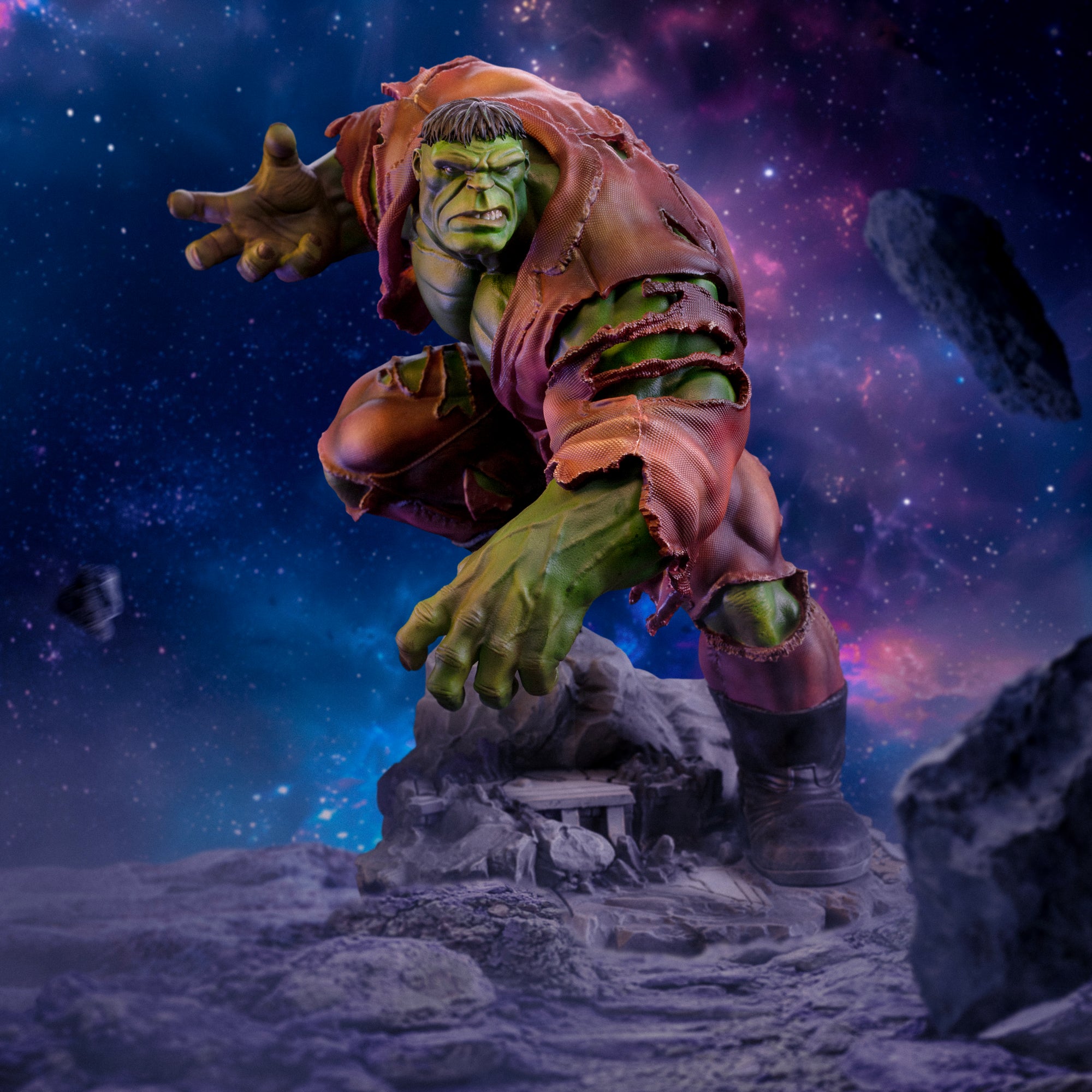 A digital diorama shot of the Hulk Deluxe statue, set in deep space with asteroids and a vibrant purple and blue galaxy background.