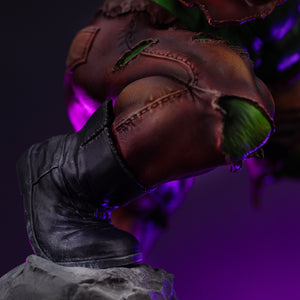A close-up of Hulk's boot and knee, highlighting the detailed sculpt of the torn brown pants and the muscle showing through.