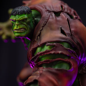 A close-up of the Hulk Deluxe statue's back and shoulder, showing the texture of his torn shirt and his powerful profile.