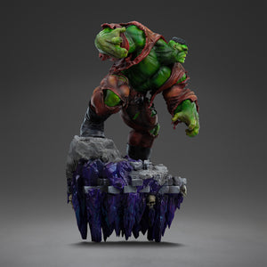 A left profile view of the Hulk Deluxe statue, highlighting his massive green form and the unique, elongated purple crystal base below the rocky platform.