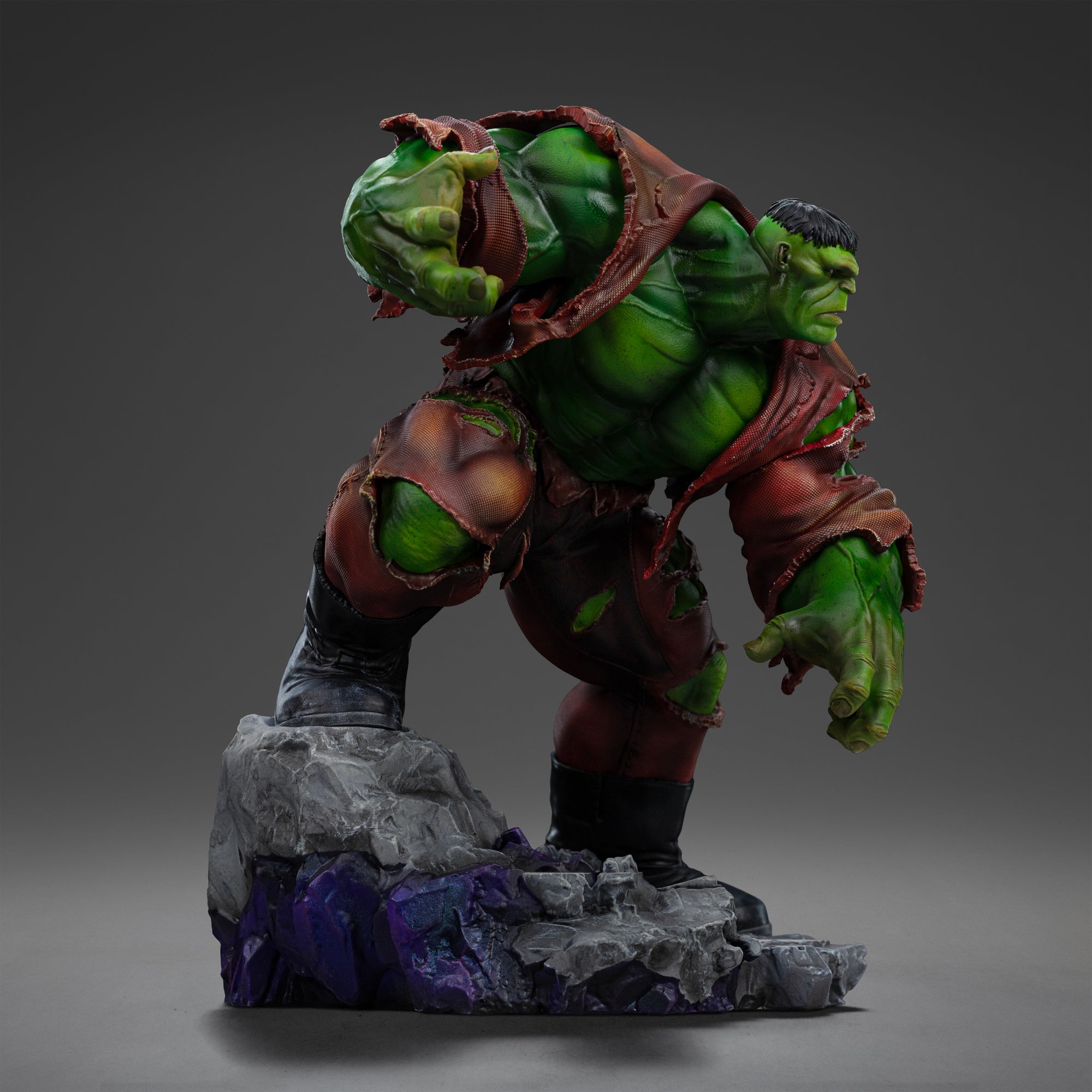 Left side view of the Hulk statue, emphasizing his powerful build and the dynamic motion of his body as he charges forward.