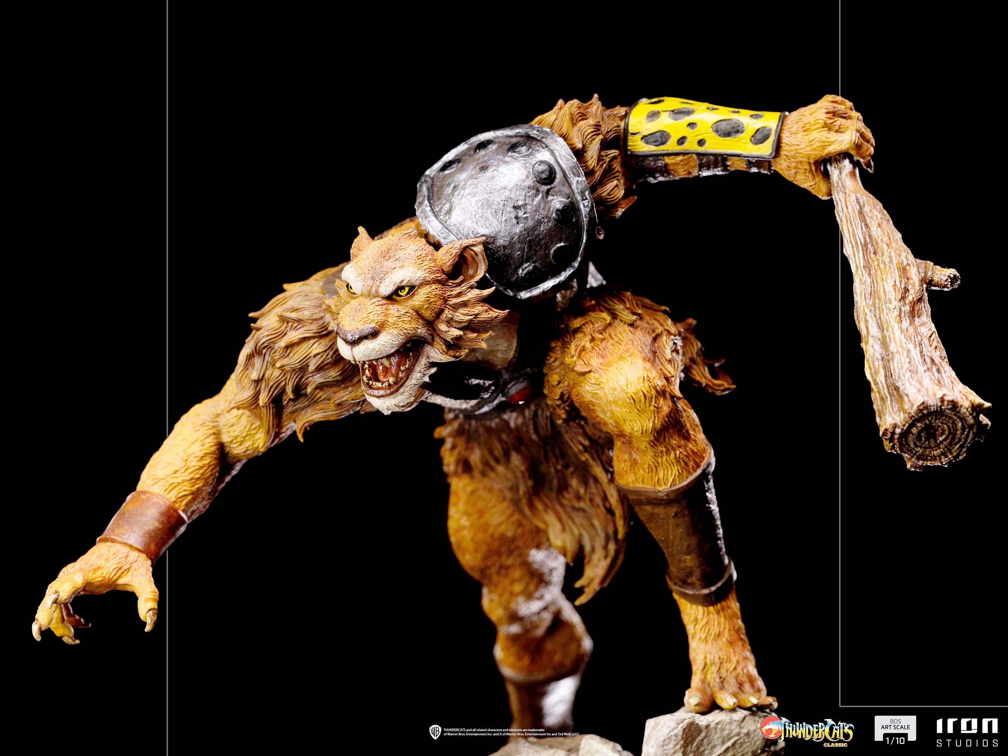 A close-up of the Jackalman statue, highlighting the detailed texture of his wooden club and his fierce expression.